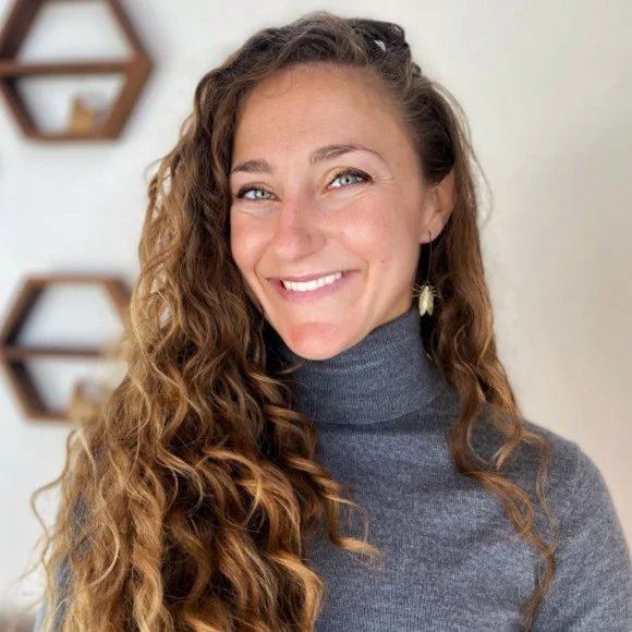 Christi Hagen, Founder of Day to Day Design, pictured smiling in grey turtleneck